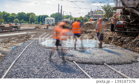 Concrete works for road construction with many workers and mixer timelapse Concrete works for road construction with many workers and mixer timelapse 139187376