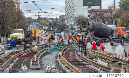 Pouring ready-mixed concrete after placing steel reinforcement to make the road by concrete mixer timelapse. Pouring ready-mixed concrete after placing steel reinforcement to make the road by concrete mixer timelapse. 139187404