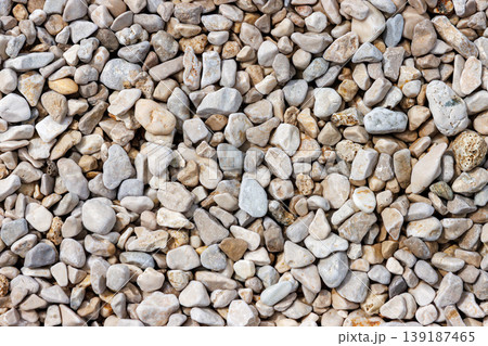 Sea pebble stone texture background top view with copy space. Sea rocks pattern 139187465