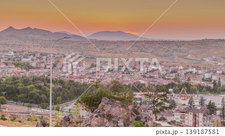 Sunset view from old castle in historical city town of Nevsehir aerial timelapse Sunset view from old castle in historical city town of Nevsehir aerial timelapse 139187581