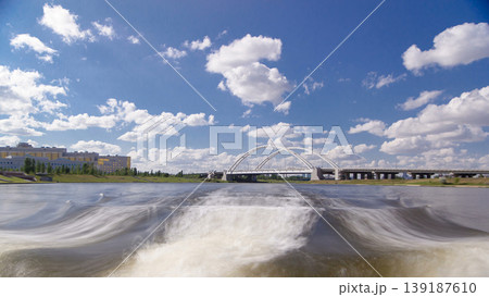 Astana, Kazakhstan. View from Pleasure boat on the river Ishim timelapse hyperlapse drivelapse in Astana. Astana, Kazakhstan. View from Pleasure boat on the river Ishim timelapse hyperlapse drivelapse in Astana. 139187610