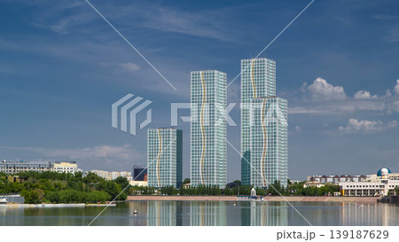Yesil river timelapse with modern towers of residential complex in Astana Yesil river timelapse with modern towers of residential complex in Astana 139187629