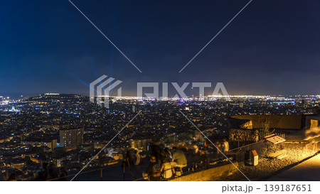 View of Barcelona timelapse, the Mediterranean sea, montjuic mountain from Bunkers Carmel. Catalonia, Spain. 139187651