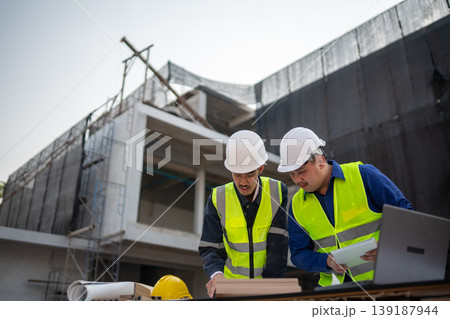 Construction project planning urban construction site business meeting outdoor workspace close-up collaboration for success Construction project planning urban construction site business meeting outdoor workspace close-up collaboration for success 139187944