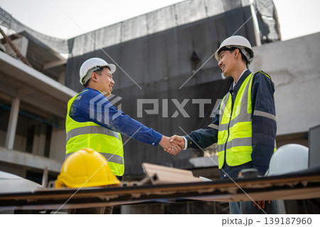 Construction collaboration meeting job site professional interaction urban environment close-up teamwork and partnership Construction collaboration meeting job site professional interaction urban environment close-up teamwork and partnership 139187960