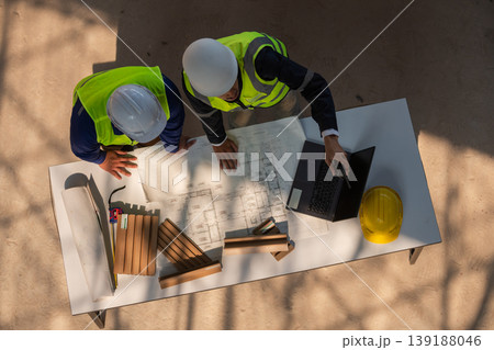 Project planning meeting construction site team collaboration indoor workspace overhead view engineering concepts 139188046