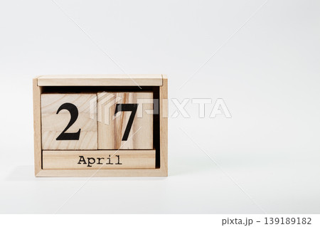 Wooden calendar April 27 on a white background Wooden calendar April 27 on a white background 139189182