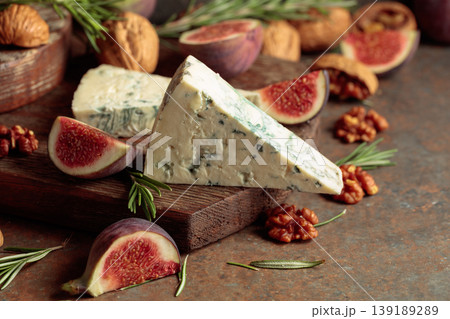 Blue cheese with fresh figs, rosemary, and walnuts. Blue cheese with fresh figs, rosemary, and walnuts. 139189289