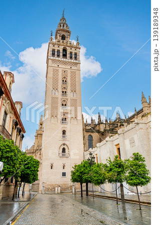 Giralda Tower In Seville With Historic Architecture And Blue Sky Giralda Tower In Seville With Historic Architecture And Blue Sky 139189348