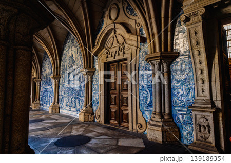 Historic azulejo tiles corridor with arches in Porto cathedral interior 139189354