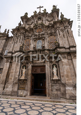Baroque church facade with azulejo tiles and tourists in Porto Baroque church facade with azulejo tiles and tourists in Porto 139189387