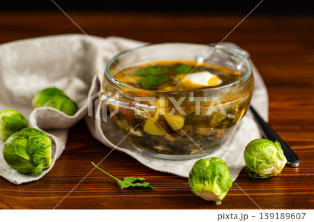green sorrel soup with Brussels sprouts and sour cream 139189607