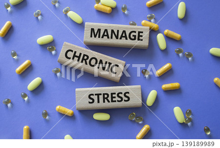 Manage Chronic Stress symbol. Concept words Manage Chronic Stress on wooden blocks. Beautiful purple background with pills. Healthcare and Manage Chronic Stress concept. Copy space. Manage Chronic Stress symbol. Concept words Manage Chronic Stress on wooden blocks. Beautiful purple background with pills. Healthcare and Manage Chronic Stress concept. Copy space. 139189989