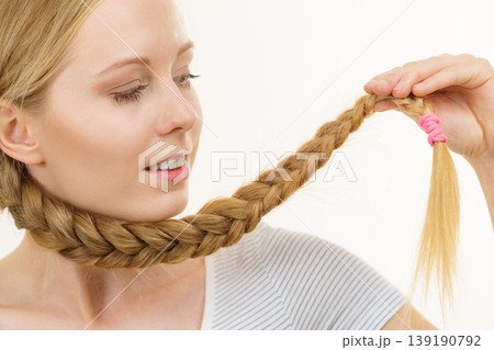 Blonde girl with braid hair Blonde girl with braid hair 139190792