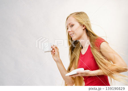Blonde girl with coffee cup 139190829