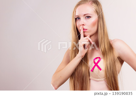 Woman pink cancer ribbon on breast 139190835