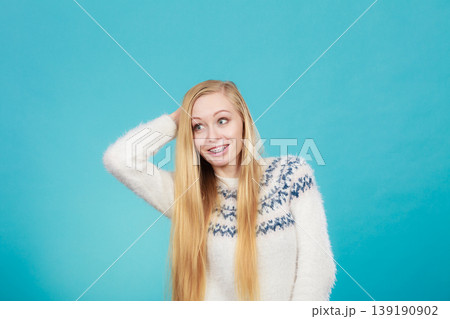 Happy woman showing her braces on teeth 139190902