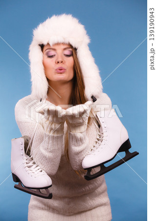 Woman with ice skates kiss gesture 139190943