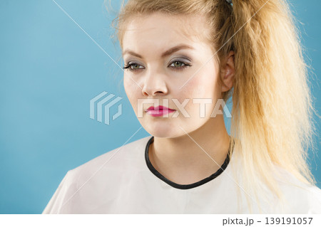 Woman wearing hairdressing collar Woman wearing hairdressing collar 139191057