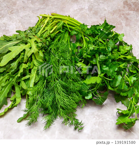 assorted fresh greens of dill parsley and arugula on the table assorted fresh greens of dill parsley and arugula on the table 139191580