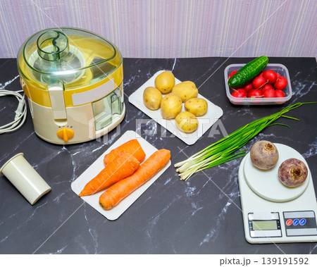 complete set of ingredients for vegetable juice and kitchen appliances on a marble table 139191592