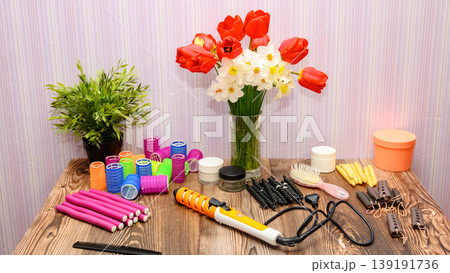 horizontal still life with hair tools and spring flowers in a vase horizontal still life with hair tools and spring flowers in a vase 139191736