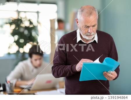Senior man office male employee read documents Senior man office male employee read documents 139194864
