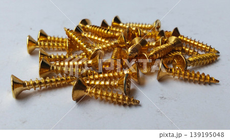 Stack of Gold Wood Screws on White Background Stack of Gold Wood Screws on White Background 139195048