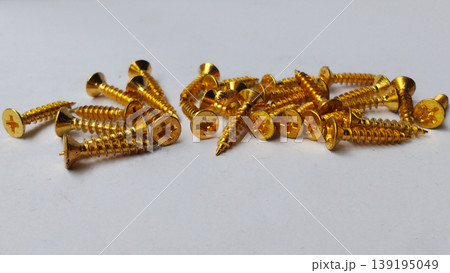 Stack of Gold Wood Screws on White Background Stack of Gold Wood Screws on White Background 139195049
