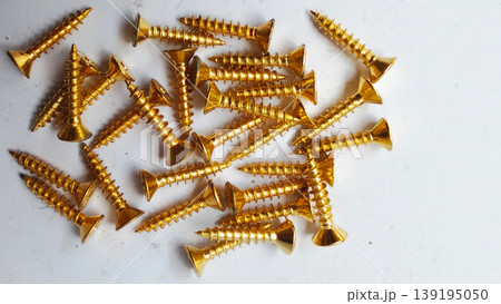Stack of Gold Wood Screws on White Background Stack of Gold Wood Screws on White Background 139195050