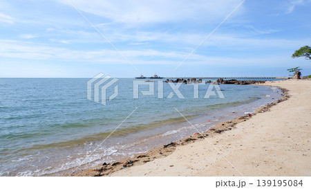 Tropical Beach Panorama with Rocks and Industrial Pier Background 139195084