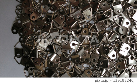 Stack of Metal Picture Hangers and Frame Kits for Hanging Wall Art 139195246