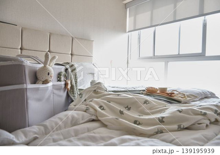 Newborn baby care items on bed at home Newborn baby care items on bed at home 139195939