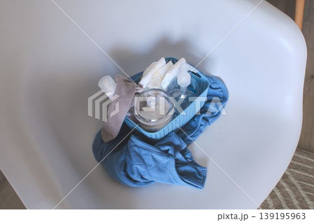 Baby care products in a blue basket for health Baby care products in a blue basket for health 139195963