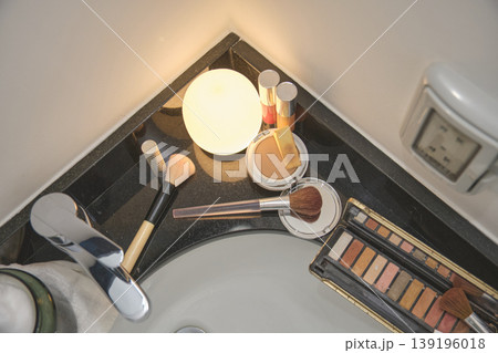 Makeup cosmetics kit on bathroom counter for beauty routine Makeup cosmetics kit on bathroom counter for beauty routine 139196018