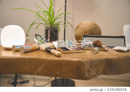 Cosmetics, makeup, and beauty products on wooden table 139196039