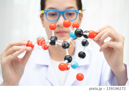 Scientist holding molecular model for chemical technology. 139196272
