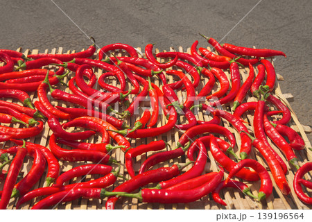 Red Chili Peppers Drying in the Sun	 139196564