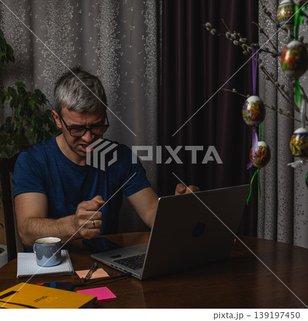 Angry freelancer reacting to problem while working on laptop at home 139197450