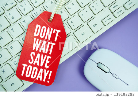 Price tag with text "Don't Wait Save Today!" and white keyboard and wireless mouse Price tag with text "Don't Wait Save Today!" and white keyboard and wireless mouse 139198288
