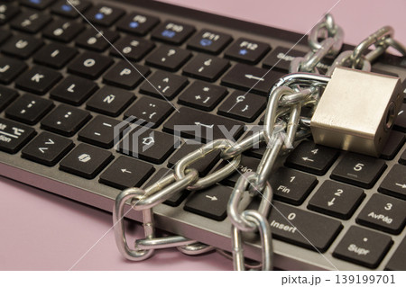 Keyboard with chain and padlock safeguarding digital information 139199701