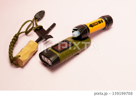 Essential survival gear with water filter and flint 139199708