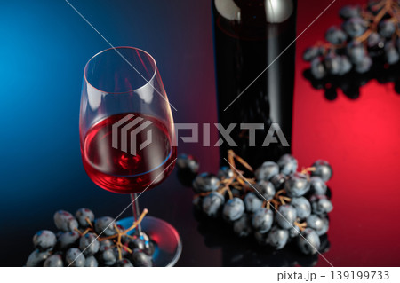 Red wine and juicy blue grapes. Red wine and juicy blue grapes. 139199733