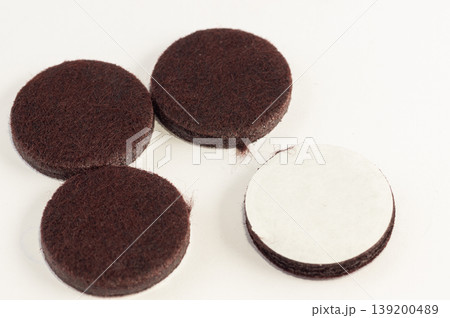 Close-up of soft stickers on furniture legs on a white background 139200489