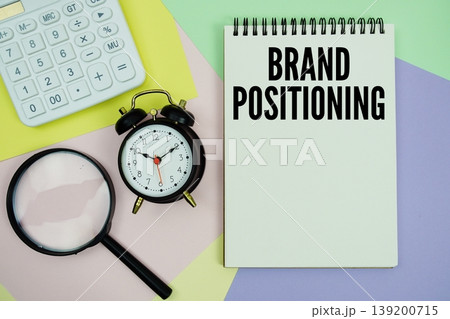 Brand Positioning text with calculator, alarm clock and magnifying glass 139200715