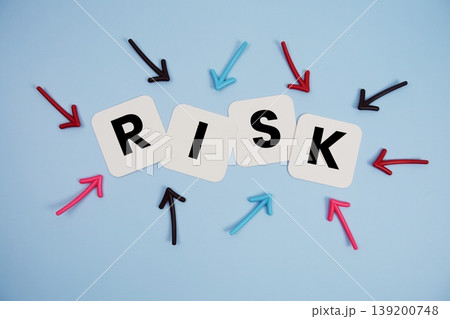 word "RISK" on cards with colorful arrows pointing toward it, highlighting the concept of prevention 139200748