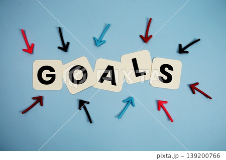 word "GOALS" on cards with colorful arrows pointing toward it, highlighting the concept of planning word "GOALS" on cards with colorful arrows pointing toward it, highlighting the concept of planning 139200766