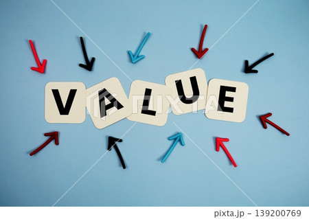word "VALUE" on cards with colorful arrows pointing toward it, highlighting the concept of quality word "VALUE" on cards with colorful arrows pointing toward it, highlighting the concept of quality 139200769