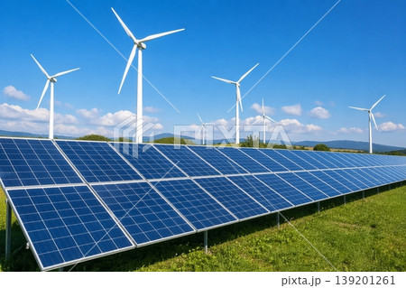 solar panels with wind turbines in the background under blue sky solar panels with wind turbines in the background under blue sky 139201261