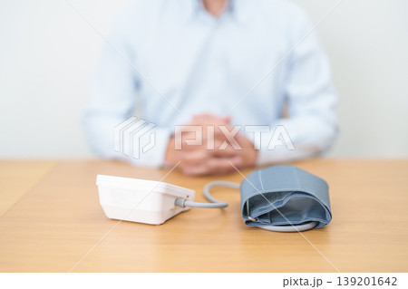 Man checking Blood pressure by Blood pressure monitor with Cuff. Systolic, SYS, Diastolic, DIA, Pulse, Hypertension, Hypotension, Heart rate, Cardiovascular Disease and May World hypertension day Man checking Blood pressure by Blood pressure monitor with Cuff. Systolic, SYS, Diastolic, DIA, Pulse, Hypertension, Hypotension, Heart rate, Cardiovascular Disease and May World hypertension day 139201642